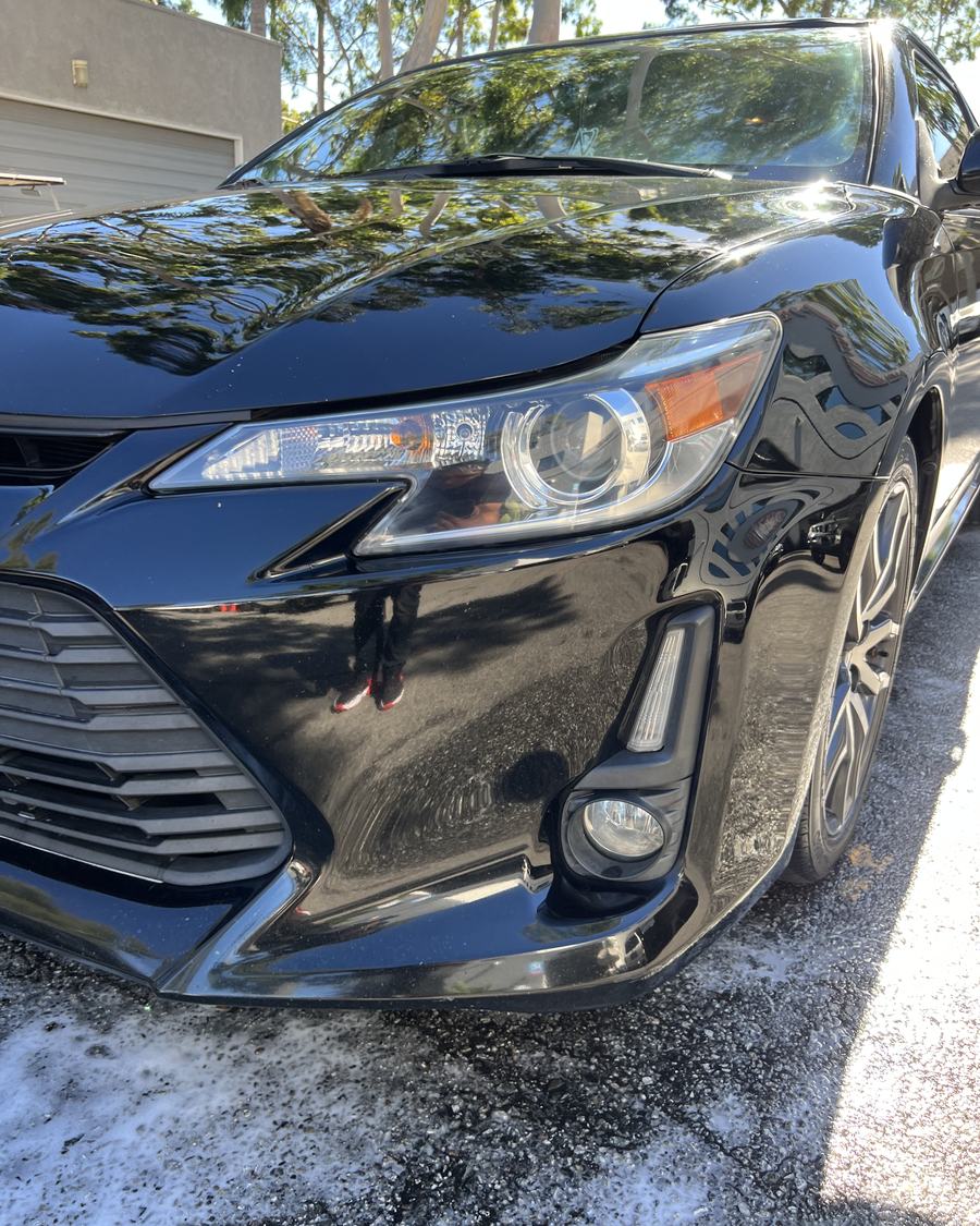 Black coupe with a deep gloss finish