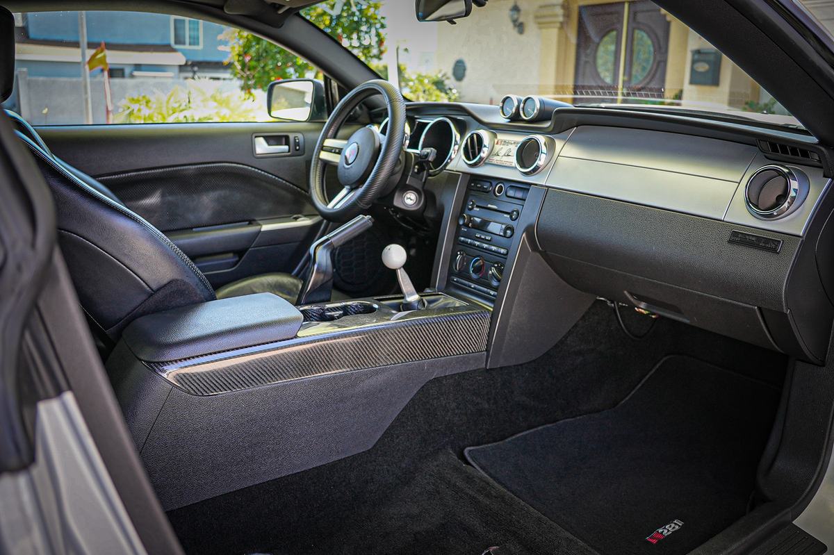 Clean car interior with carbon trim and fresh carpets