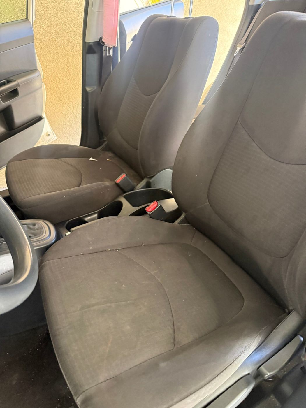 Car seat before an interior deep clean, stained and dusty